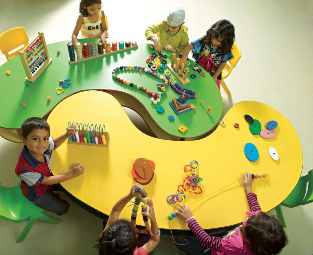 A vibrant classroom at The Creek SEEDS School filled with children engaging in creative learning activities, showcasing a nurturing environment for early education.